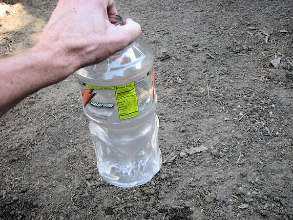 Place bottle on ground
