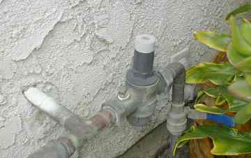 Pressure regulator at house entry point.