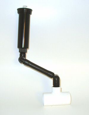 A preassembled flexible pipe swing riser attached to a PVC fitting and a pop-up sprinkler.